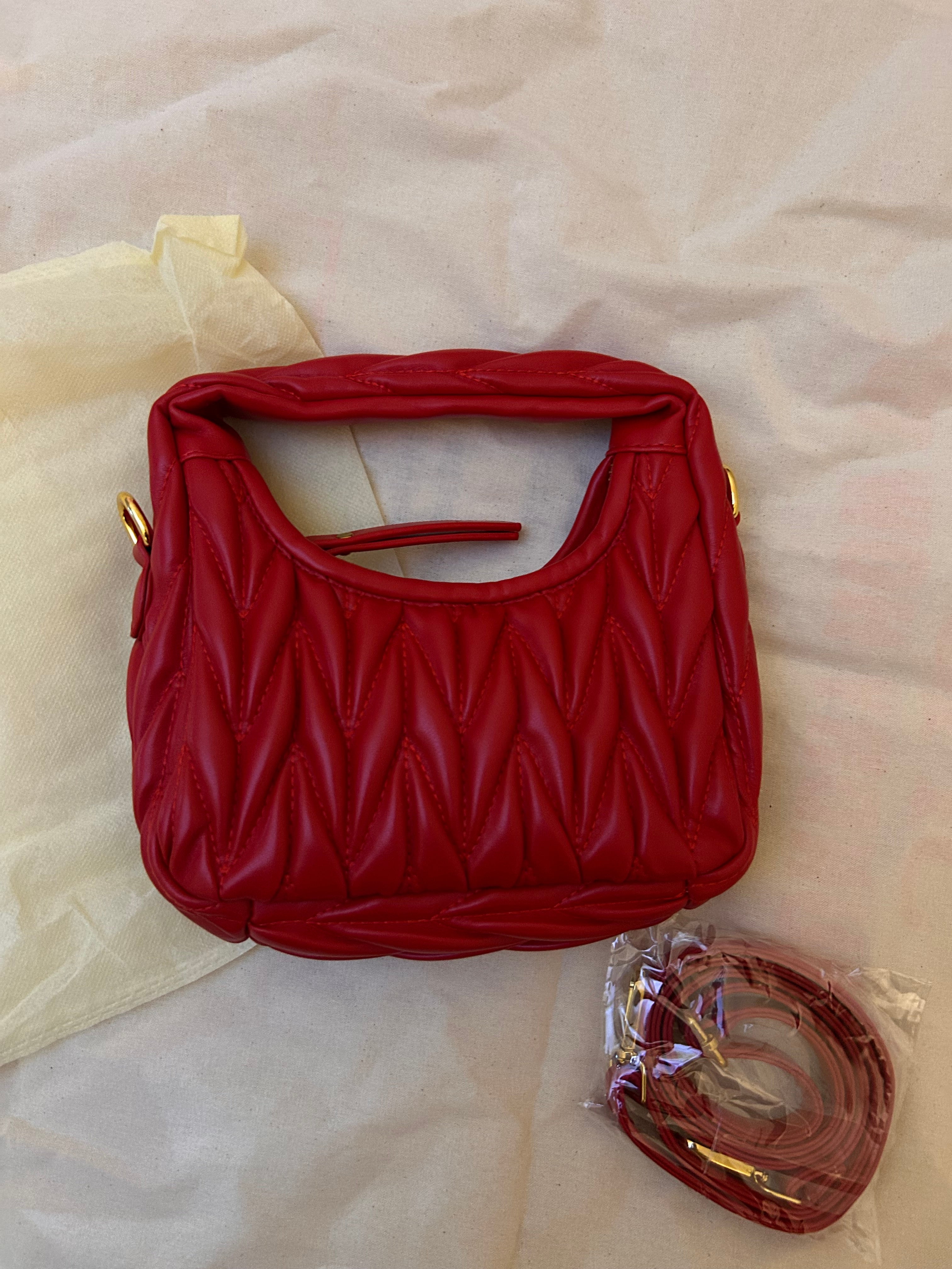 Red quilted leather bag with gold hardware