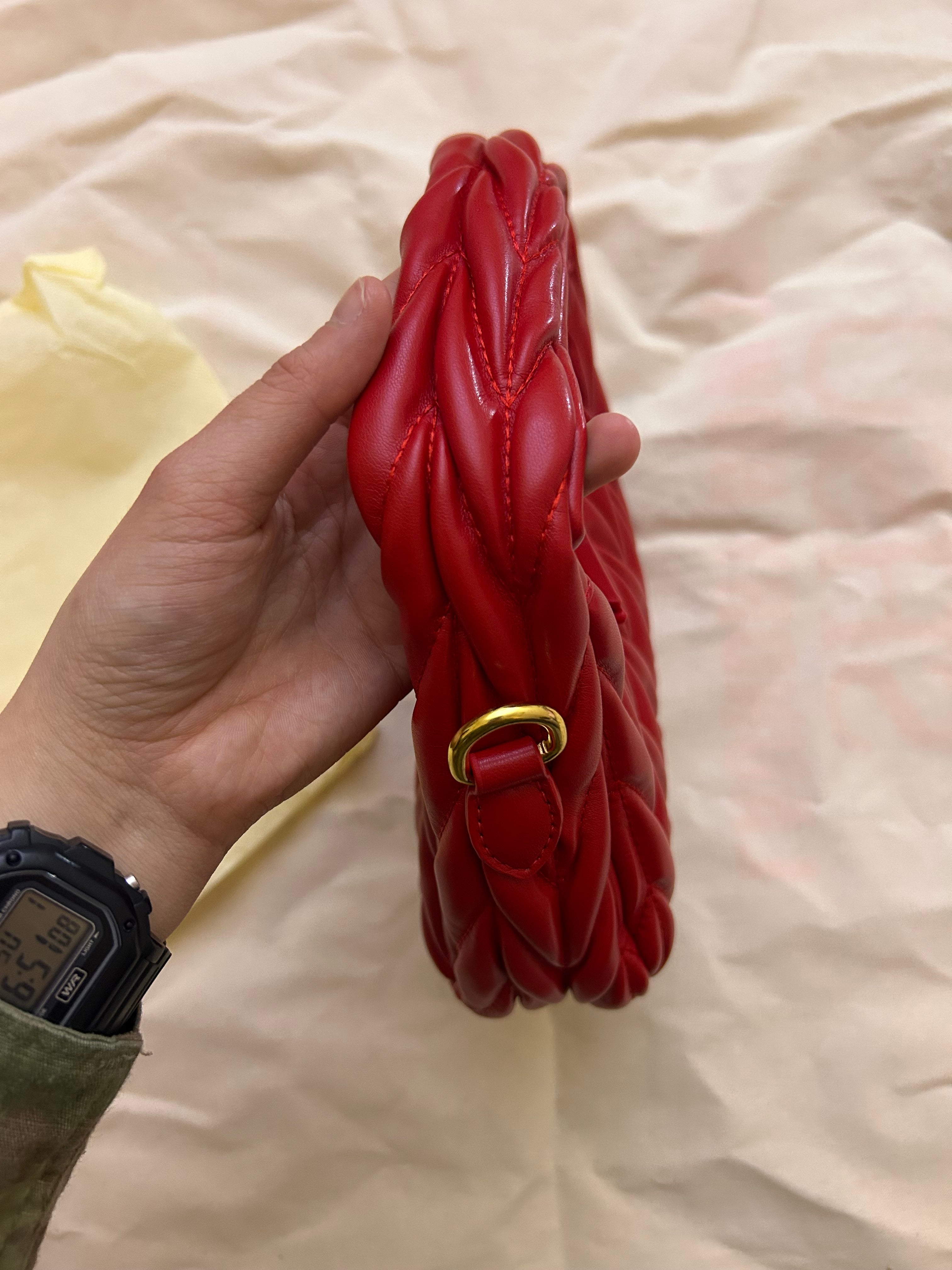 Red quilted leather bag with gold hardware