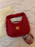 Red quilted leather bag with gold hardware